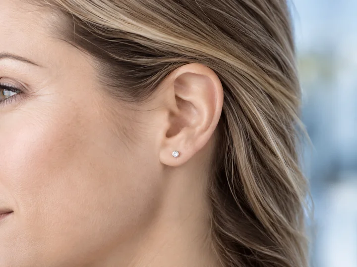 Close-up of a woman’s ear and side of her face